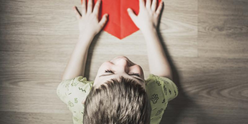 NC Housing Finance Agency Helps More North Carolinians Purchase Homes a child holding a paper heart
